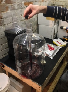 Racking the wine off the last sediment into a larger 6 gallon better bottle to make degassing and the addition of stabilizers and clarifiers easier.
